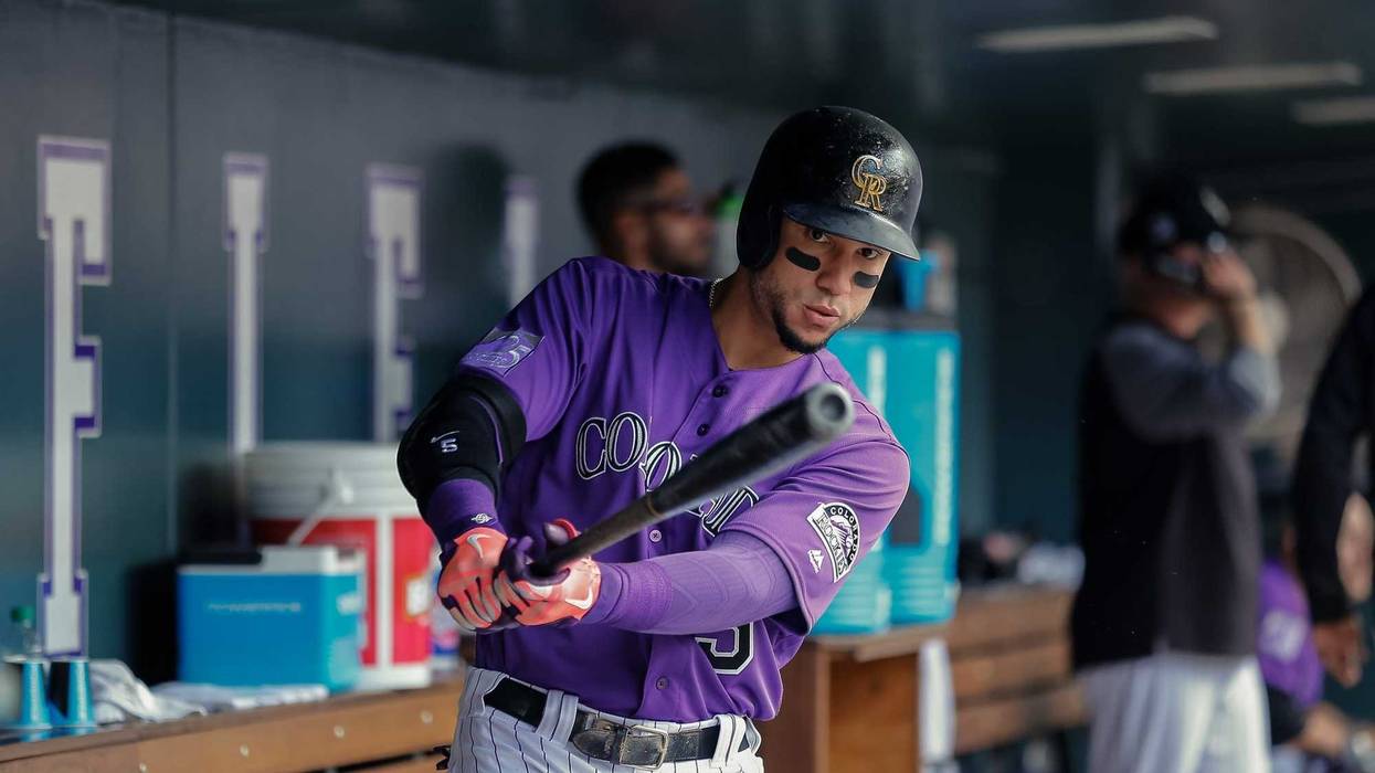 Sep 27, 2018; Denver, CO, USA; Colorado Rockies right fielder Carlos Gonzalez (5) in the dugout in the seventh inning against the Philadelphia Phillies at Coors Field. Mandatory Credit: Isaiah J. Downing-USA TODAY Sports