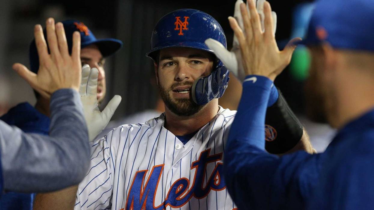 Sep 27, 2018; New York City, NY, USA; New York Mets catcher Kevin Plawecki (26) celebrates in the dugout with teammates after hitting a solo home run against the Atlanta Braves during the third inning at Citi Field. Mandatory Credit: Brad Penner-USA TODAY