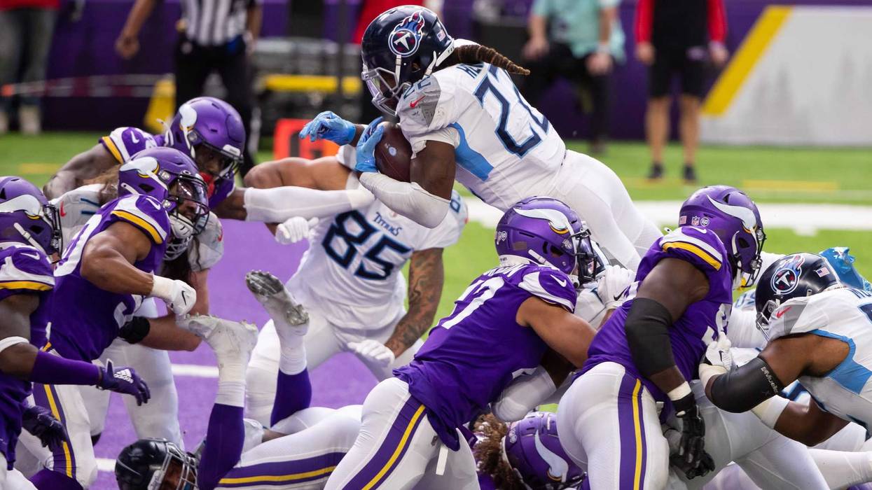 Sep 27, 2020; Minneapolis, Minnesota, USA; Tennessee Titans running back Derrick Henry (22) scores a touchdown in the third quarter against the Minnesota Vikings at U.S. Bank Stadium. Mandatory Credit: Brad Rempel-USA TODAY Sports