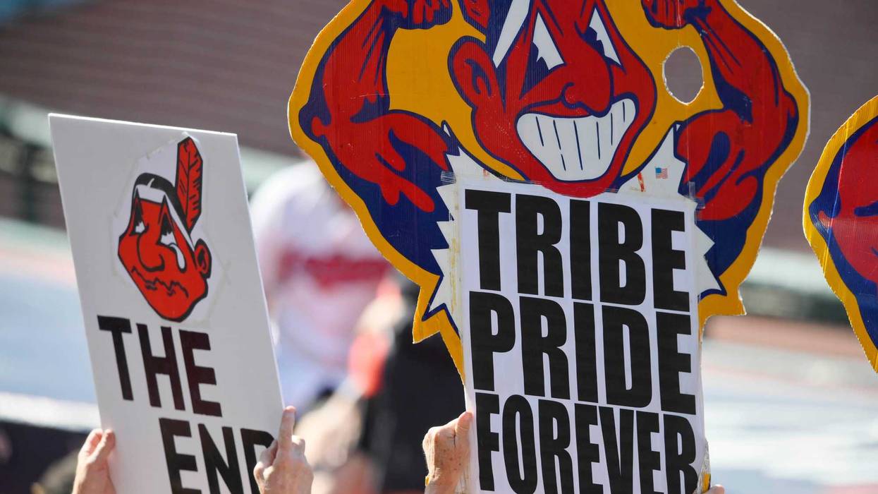 Sep 27, 2021; Cleveland, Ohio, USA; Fans hold signs featuring Cleveland Indians mascot Chief Wahoo during a game between the Cleveland Indians and the Kansas City Royals at Progressive Field.