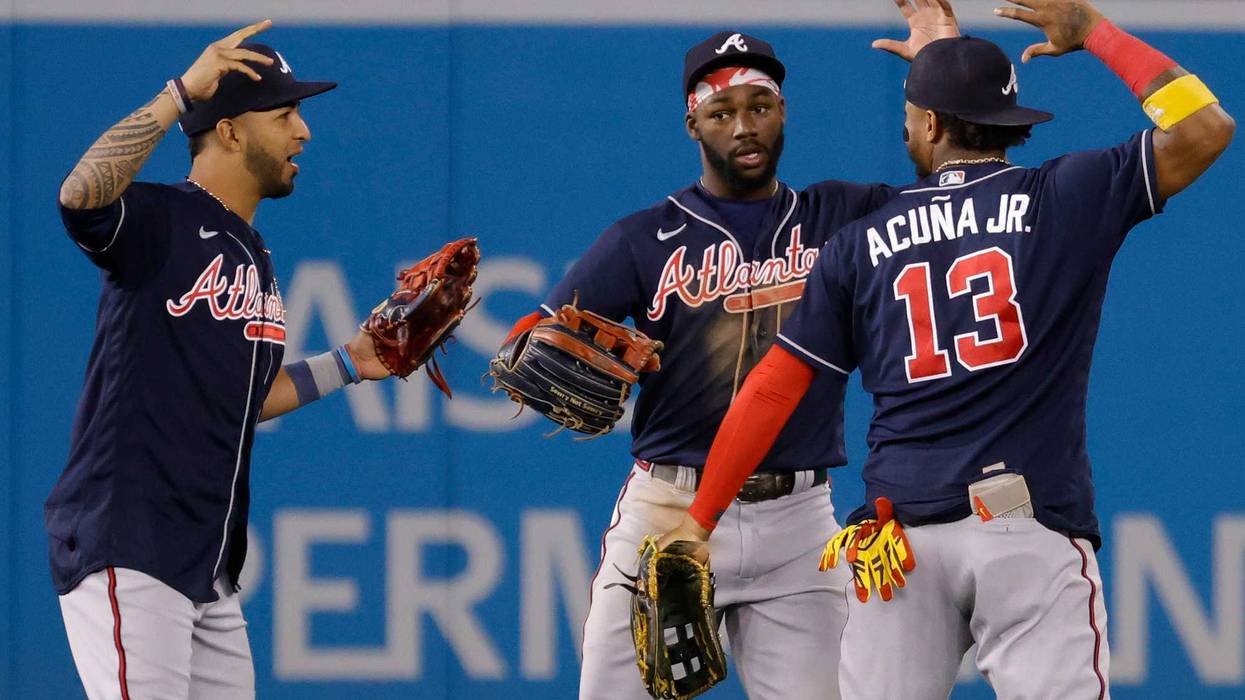 Sep 27, 2022; Washington, District of Columbia, USA; Atlanta Braves left fielder Eddie Rosario (8), Braves center fielder Michael Harris II (23), and Braves right fielder Ronald Acuna Jr. (13) celebrate after their game against the Washington Nationals at Nationals Park.