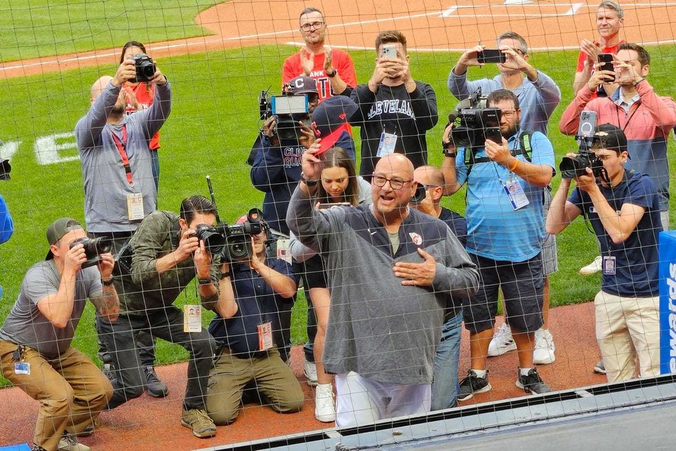 Sep 27, 2023; Cleveland, Ohio, USA; Cleveland Guardians manager Terry Francona (77) waves to cheering fans after a video tribute in his honor was broadcast on the scoreboard before a game against the Cincinnati Reds at Progressive Field
