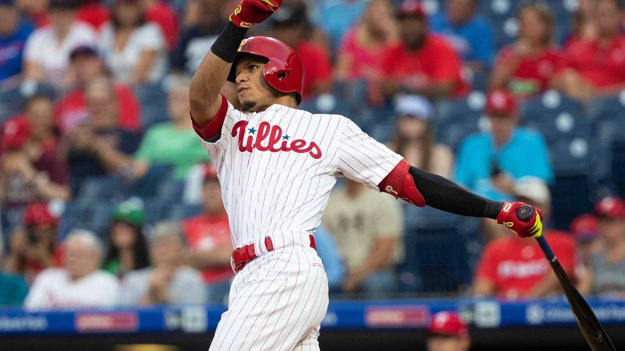 Sep 28, 2019; Philadelphia, PA, USA; Philadelphia Phillies second baseman Cesar Hernandez (16) hits a home run during the first inning against the Miami Marlins at Citizens Bank Park. Mandatory Credit: Bill Streicher-USA TODAY Sports