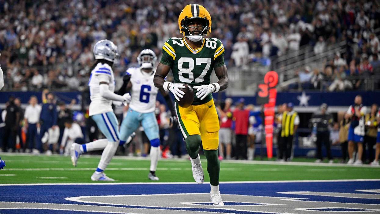 Sep 28, 2025; Arlington, Texas, USA; Green Bay Packers wide receiver Romeo Doubs (87) celebrates in the end zone after he catches a pass for a touchdown during the game between the Dallas Cowboys and the Green Bay Packers at AT&T Stadium. Mandatory Credit: Jerome Miron-Imagn Images