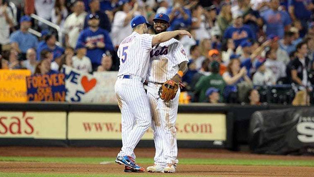 Sep 29, 2018; New York Mets third baseman David Wright (5) hugs New York Mets shortstop Jose Reyes (7) after being shown on the \"kiss cam\" during the fifth inning against the Miami Marlins at Citi Field. Brad Penner-USA TODAY Sports