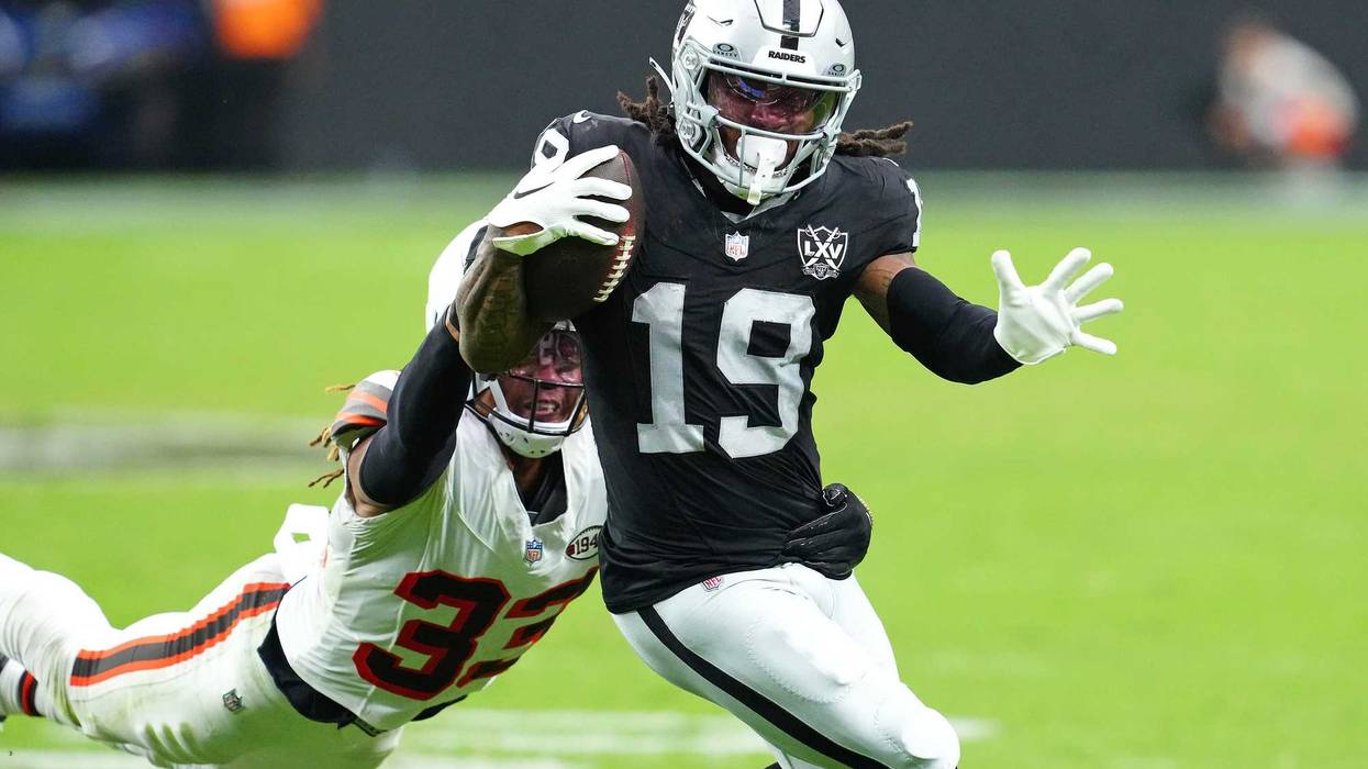 Sep 29, 2024; Paradise, Nevada, USA; Las Vegas Raiders wide receiver DJ Turner (19) evades the tackle of Cleveland Browns safety Ronnie Hickman (33) to score a touchdown during the third quarter at Allegiant Stadium. Mandatory Credit: Stephen R. Sylvanie-Imagn Images