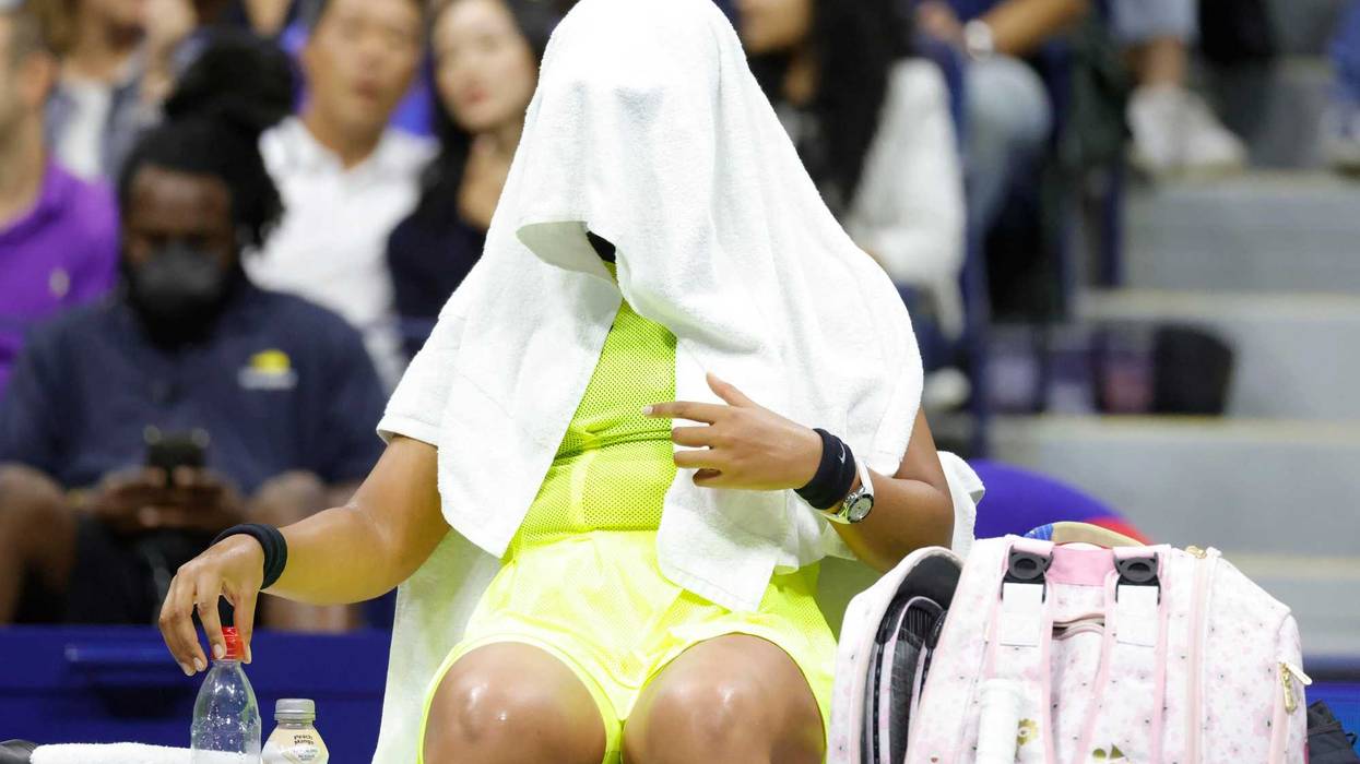 Sep 3, 2021; Flushing, NY, USA; Naomi Osaka of Japan covers her head with a towel during a change of ends against Leylah Fernandez of Canada in a third round match on day five of the 2021 U.S. Open tennis tournament at USTA Billie Jean King National Tennis Center.