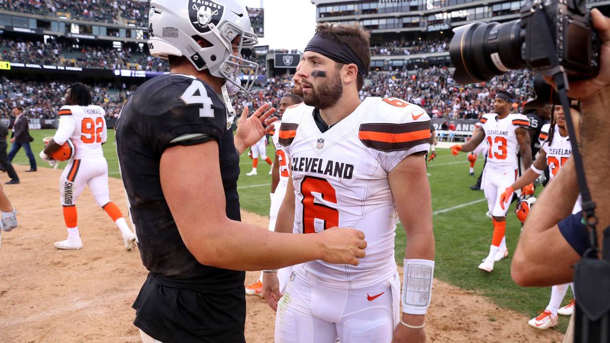 Sep 30, 2018; Oakland, CA, USA; Oakland Raiders quarterback Derek Carr (4) meets with Cleveland Browns quarterback Baker Mayfield (6) after the game at Oakland Coliseum. Mandatory Credit: Cary Edmondson-USA TODAY Sports