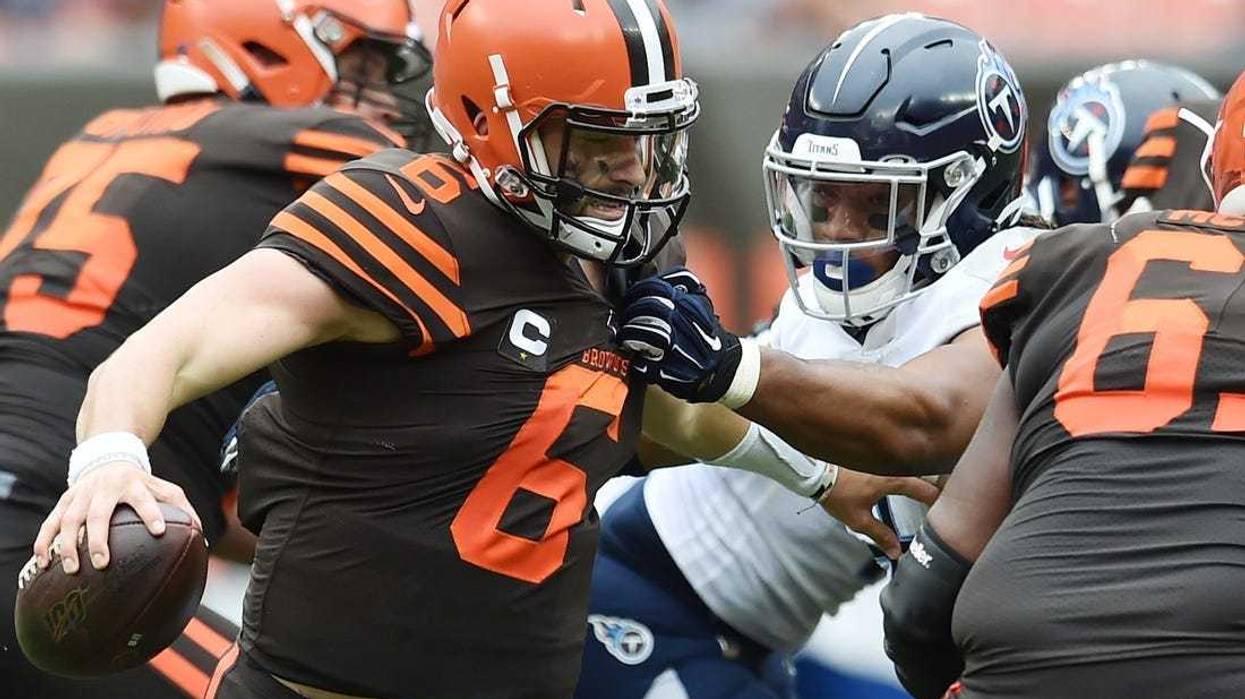 Sep 8, 2019; Cleveland, OH, USA; Tennessee Titans linebacker Sharif Finch (56) gets a hand on the shirt of Cleveland Browns quarterback Baker Mayfield (6) during the second half at FirstEnergy Stadium. Mandatory Credit: Ken Blaze-USA TODAY Sports