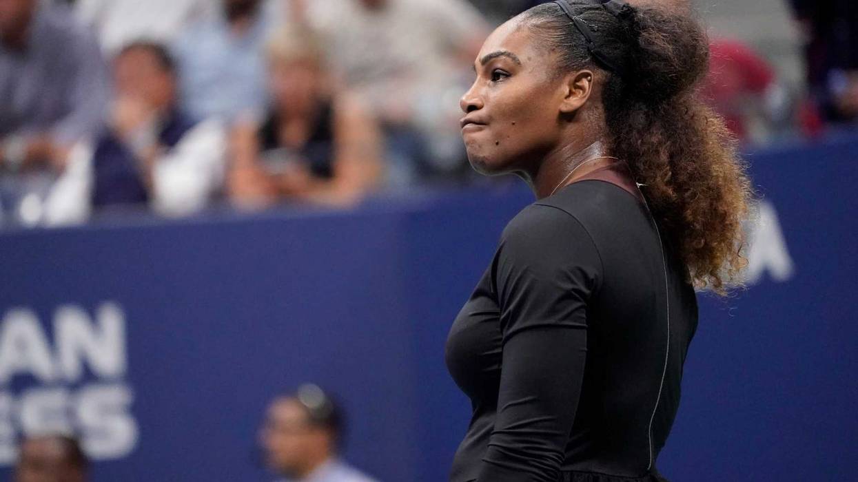 Serena Williams awaits her serve as boos rain down after an argument with officials while playing Naomi Osaka in the women's final on Sept. 8, 2018, at the U.S. Open at the USTA Billie Jean King National Tennis Center.