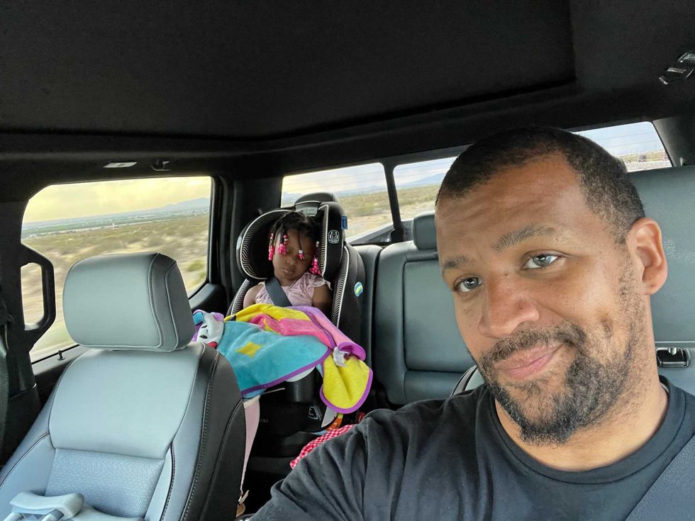 Sergio Rodriguez and his 4-year-old daughter, Karma, napping on their road trip
