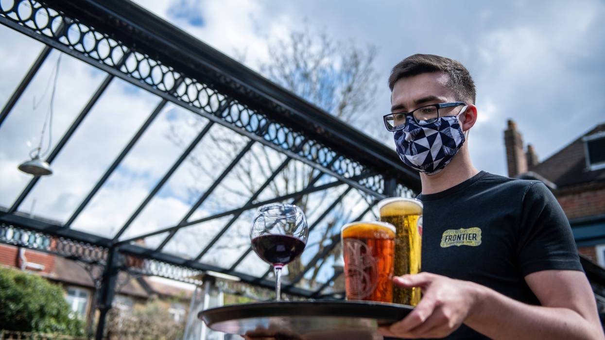 Server holding drinks