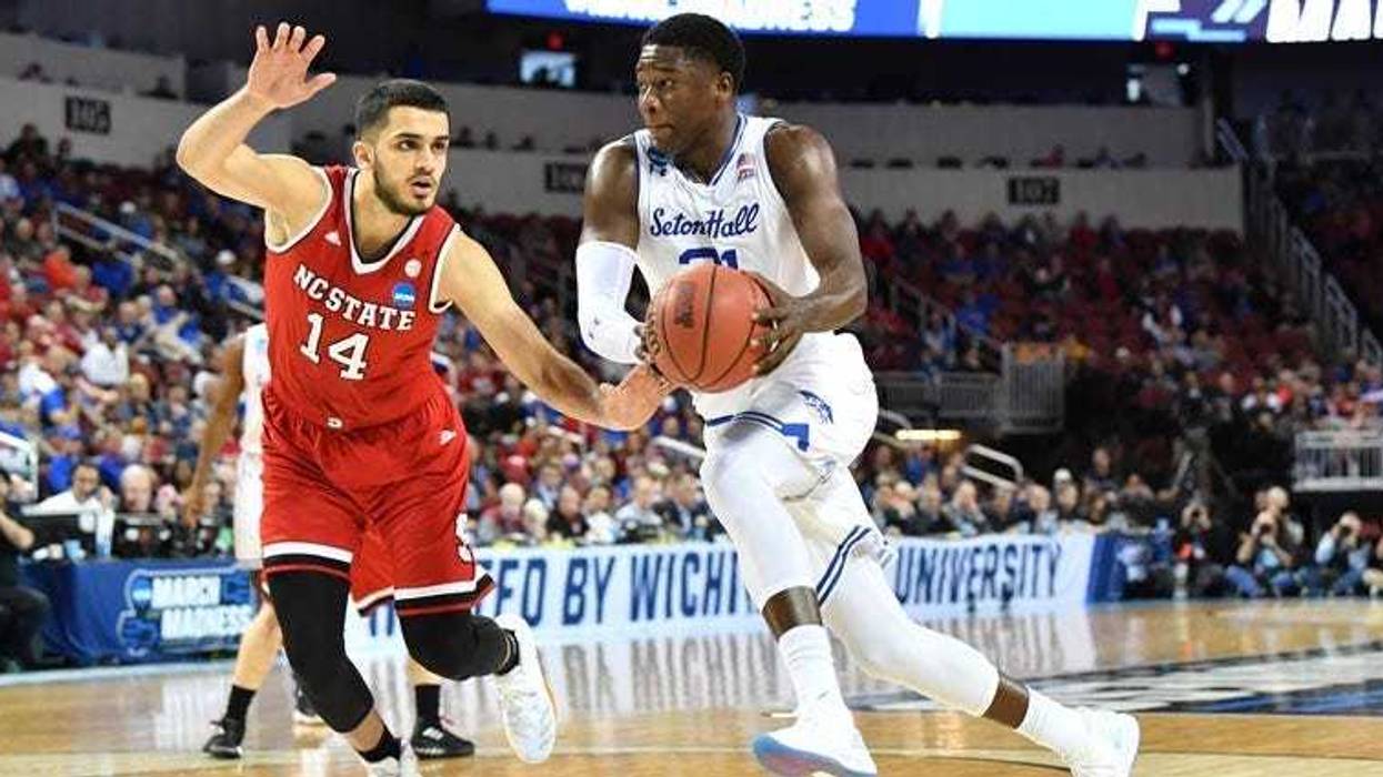 Seton Hall center Angel Delgado drives to the basket against North Carolina State's Omer Yurtseven in the first round of the 2018 NCAA tournament on March 15, 2018, in Wichita, Kansas.