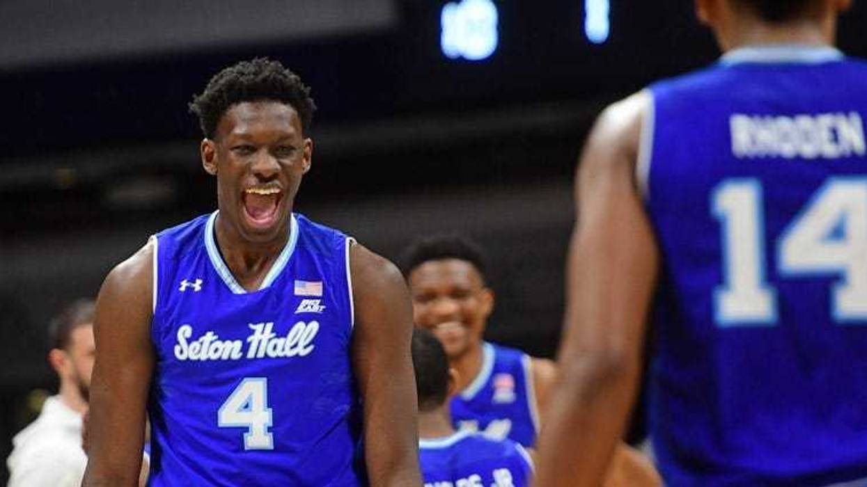 Seton Hall's Khadeen Carrington gets the ball pats North Carolina State's Allerik Freeman in the first round of the NCAA tournament on March 15, 2018, in Wichita, Kansas.
