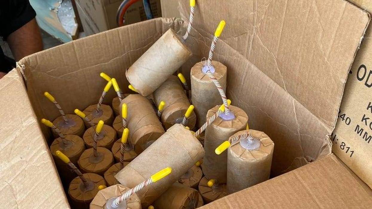 Seventeen people were injured and 22 vehicles were damaged when LAPD Bomb Squad attempted to dispose of 5,000 pounds of commercial grade illegal fireworks in South Los Angeles on June 30 . Photo by Pete Demetriou/KNX 1070 Newsradio