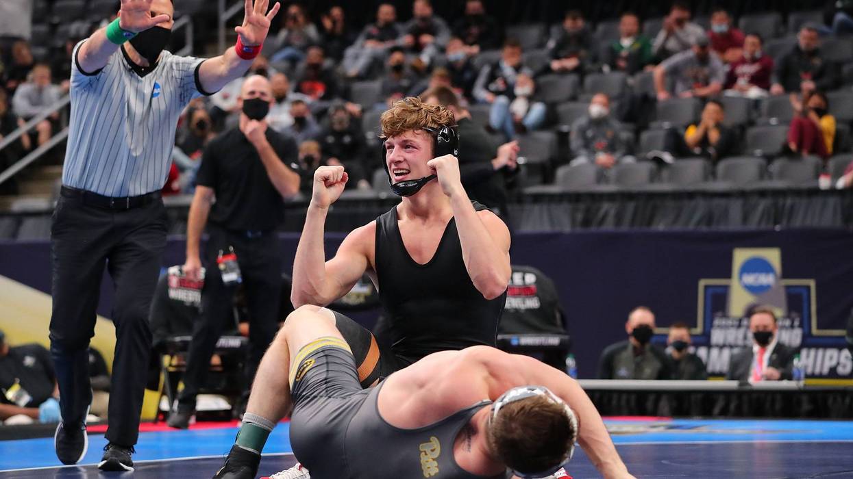 Shane Griffith of Stanford celebrates after beating Jake Wentzel in the 165lb weight class in the first-place match during the NCAA Division I Men's Wrestling Championship at the Enterprise Center on March 20, 2021 in St Louis, Missouri.
