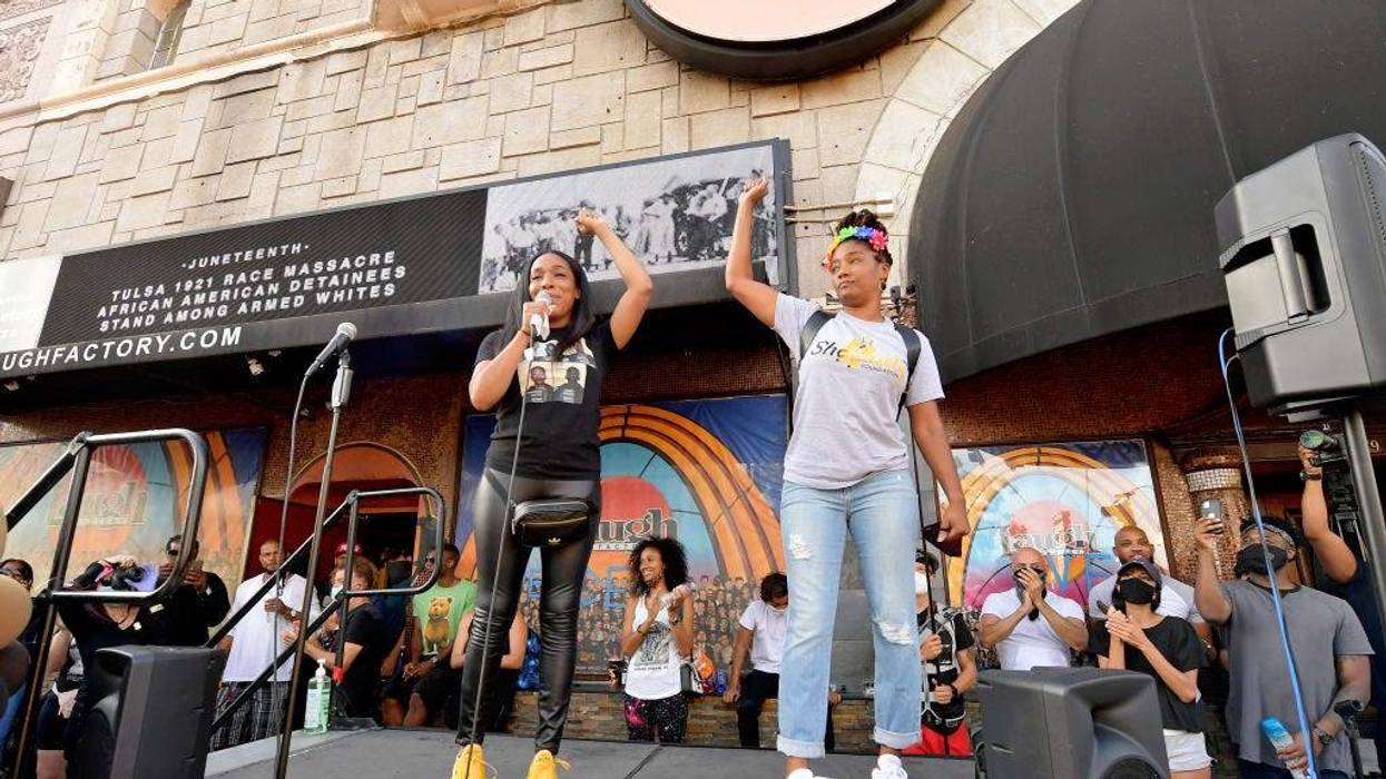 Shannon Morton of Black Women Lead and Tiffany Haddish speak onstage at Comic and Hollywood Communities Coming Together to Mark Juneteenth Anniversary of Freedom on June 19, 2020 in West Hollywood, California.