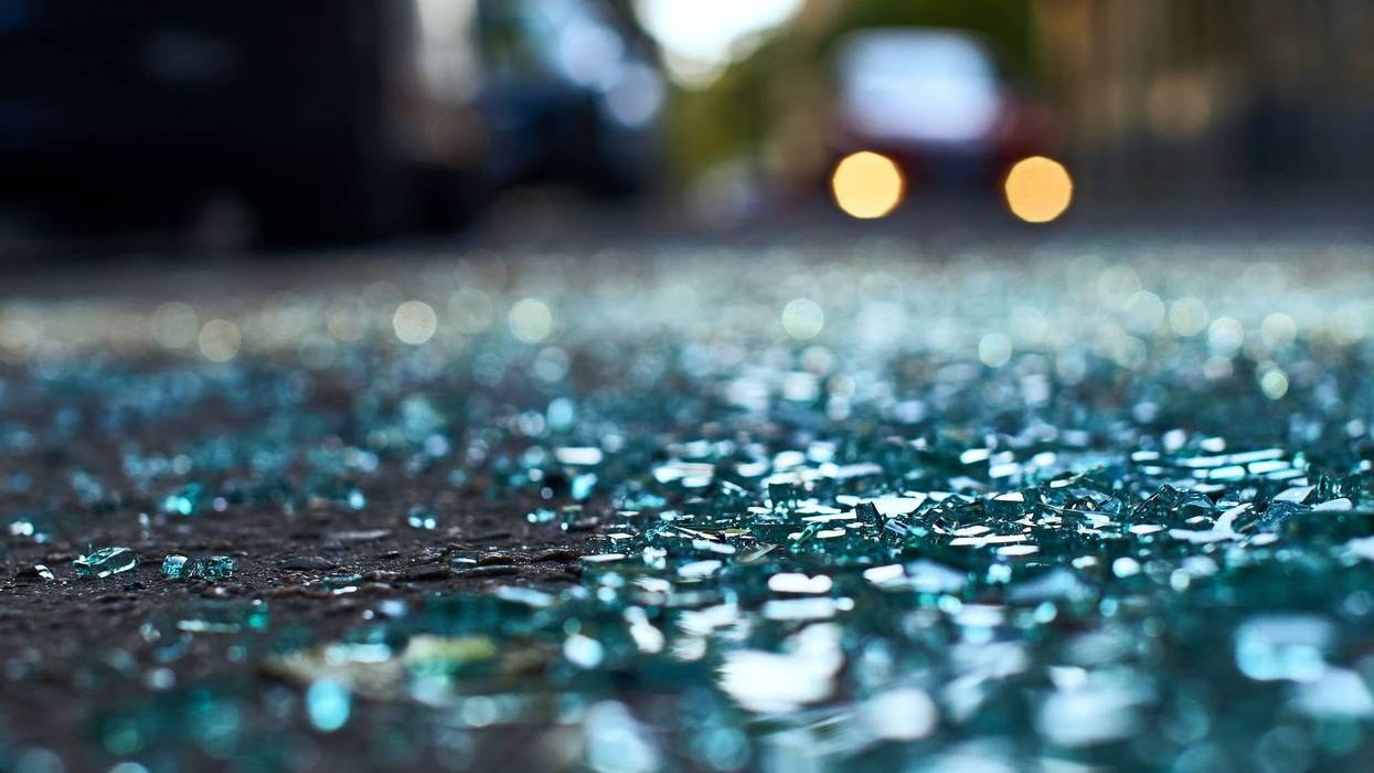 Sharp shards of car glass on the asphalt