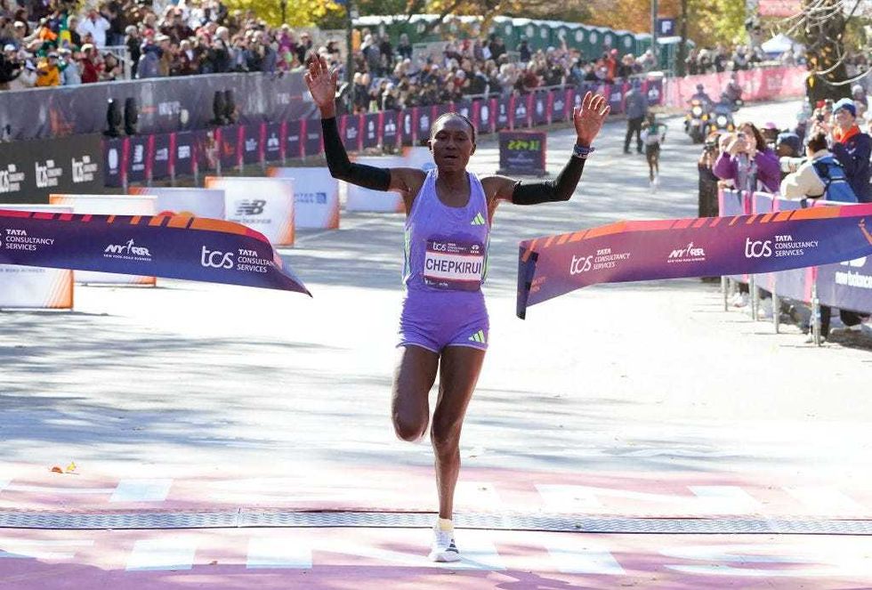 Sheila Chepkirui of Kenya crosses the finish line to win the women