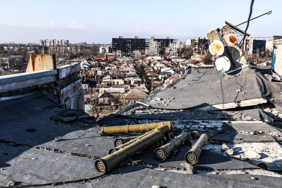 Shell fragments are seen on a rooftop in the city of Mariupol.