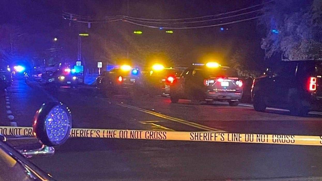 sheriff vehicles behind police tape