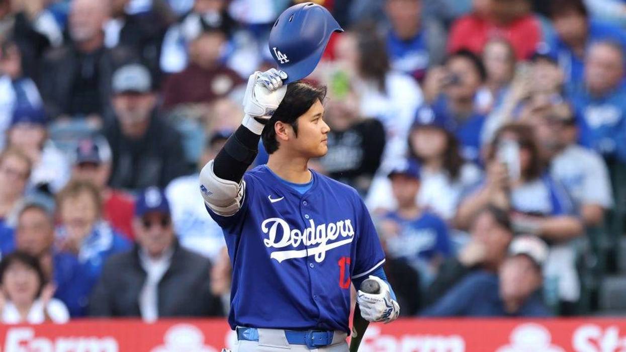 Shohei Ohtani #17 of the Los Angeles Dodgers acknowledges the crowd after the Los Angeles Angels played a tribute video in the first inning of a game between the Los Angeles Angels and the Los Angeles Dodgers at Angel Stadium of Anaheim on March 26, 2024 in Anaheim, California.