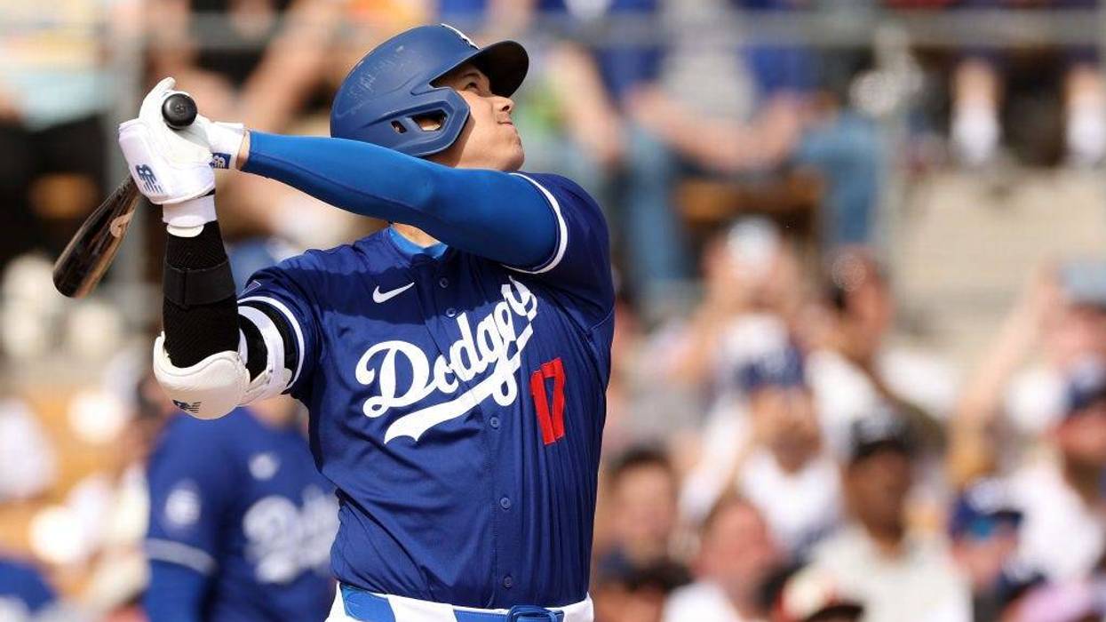 Shohei Ohtani #17 of the Los Angeles Dodgers hits a two-run home run in the fifth inning inning during a game against the Chicago White Sox at Camelback Ranch on February 27, 2024 in Glendale, Arizona.