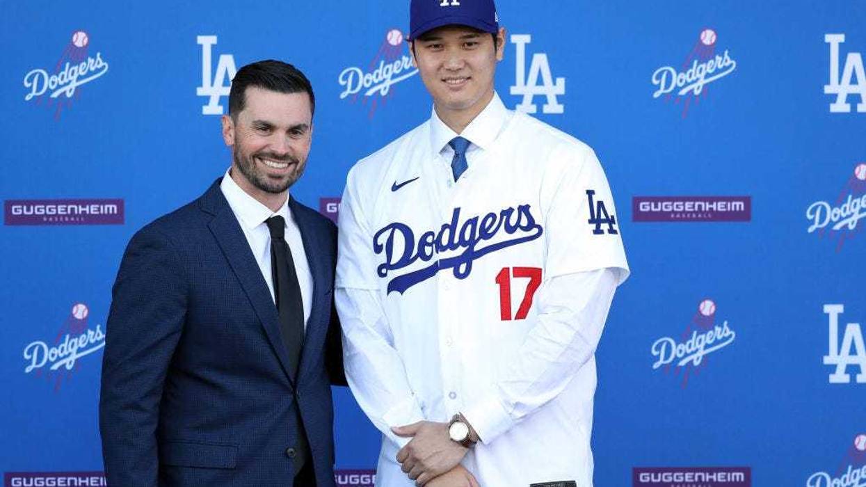 Shohei Ohtani poses for a photo with General Manager Brandon Gomes at Dodger Stadium on December 14, 2023 in Los Angeles, California.