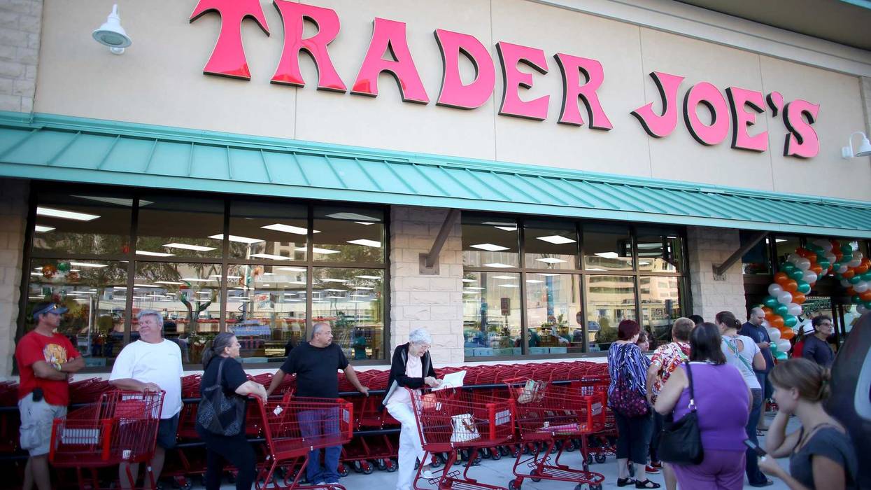 Shoppers lineup as they wait for the grand opening of a Trader Joe's in Pinecrest, Fla.
