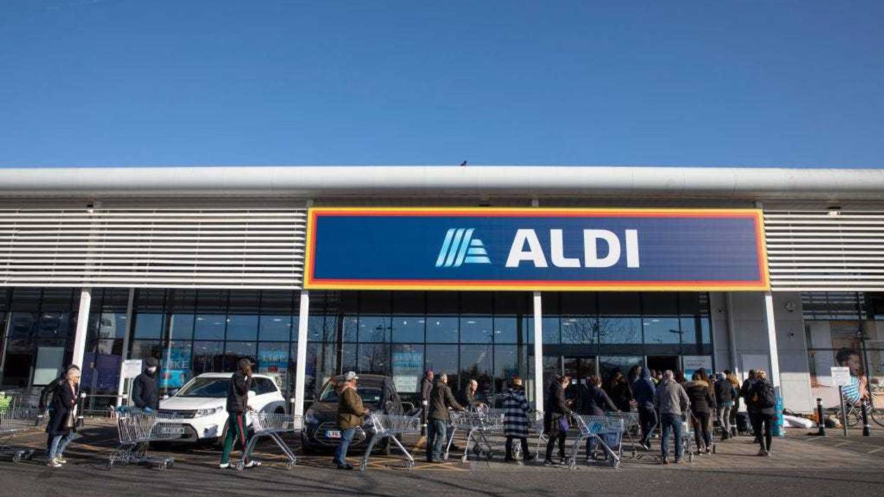 Shoppers queue outside an Aldi supermarket on March 23, 2020 in London, England. Coronavirus (COVID-19) pandemic has spread to at least 182 countries, claiming over 10,000 lives and infecting hundreds of thousands more.