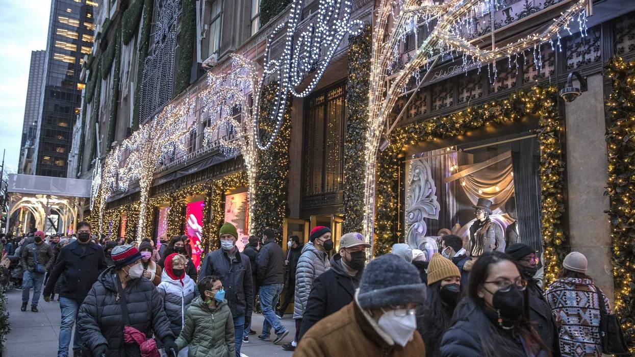 Shoppers walk past Saks Fifth Avenue in Manhattan in December 2021