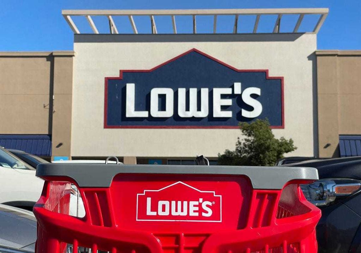 shopping cart sits in front of a Lowe's store on November 21, 2023 in Pacoima, California.