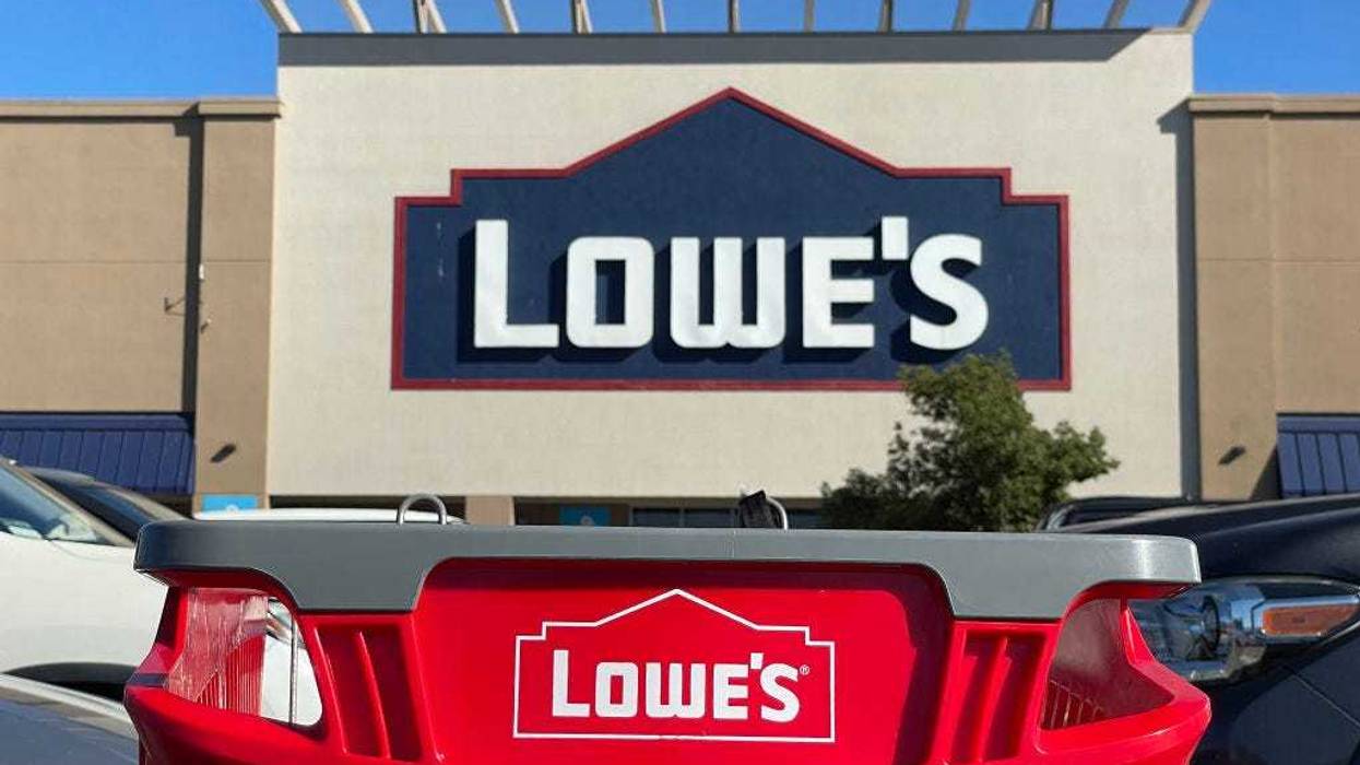 shopping cart sits in front of a Lowe's store on November 21, 2023 in Pacoima, California.