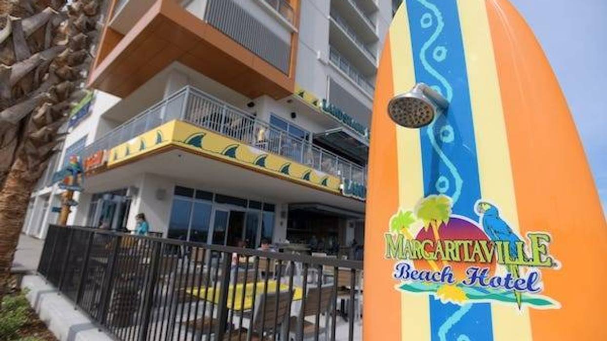 Showers built into surfboards along the boardwalk behind the Margaritaville Beach Hotel