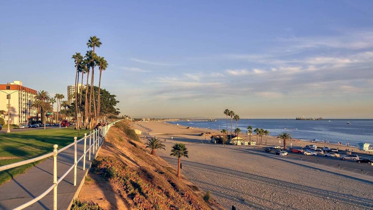 sidewalk along beach at sunset