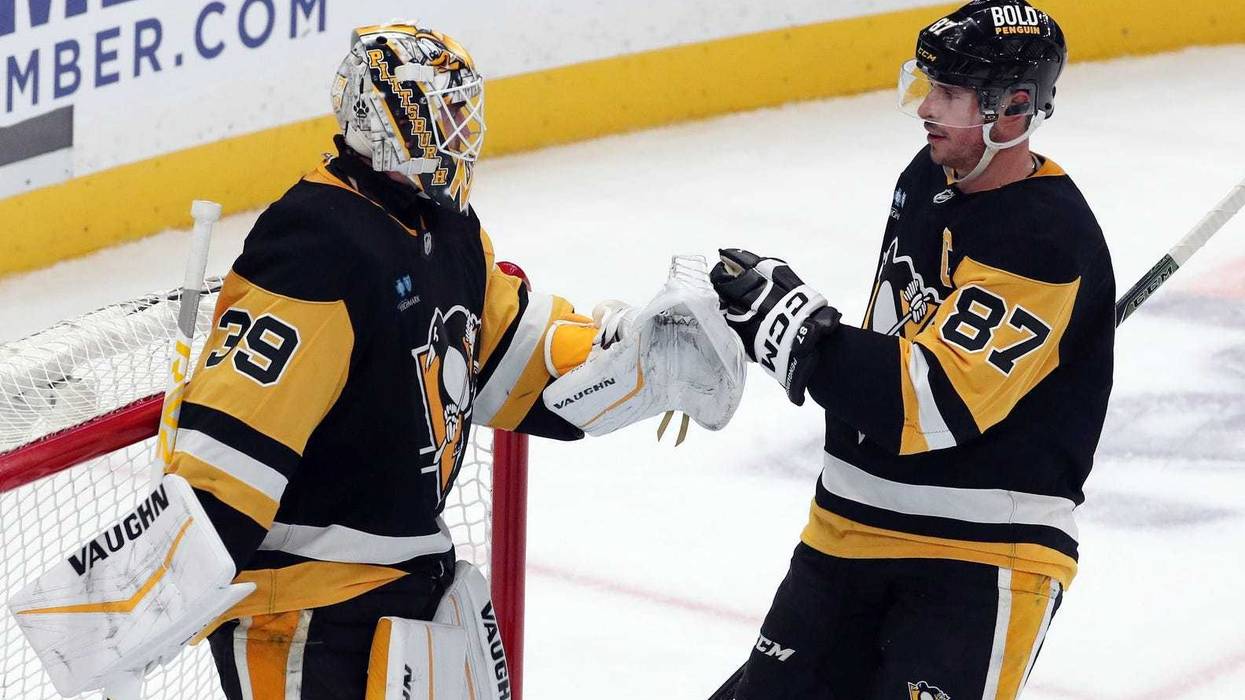 Sidney Crosby and Alex Nedeljkovic after win