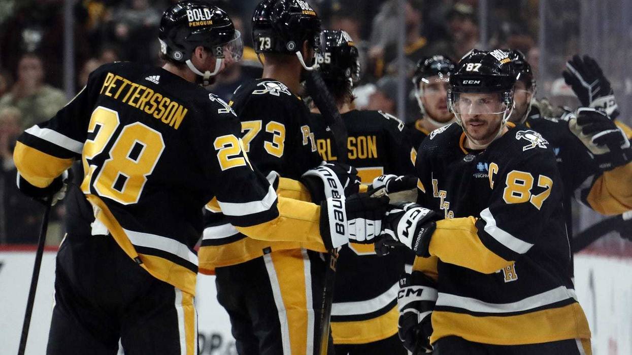 Sidney Crosby celebrating with teammates