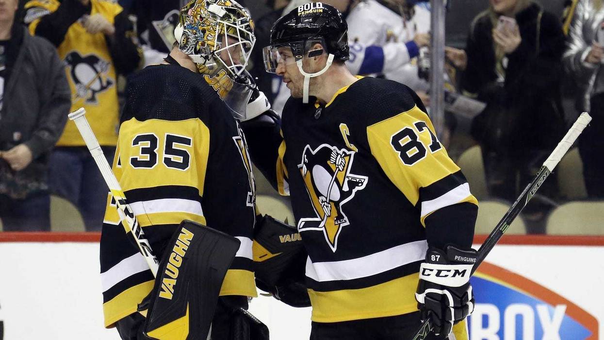 Sidney Crosby congratulates goal tender Tristan Jarry