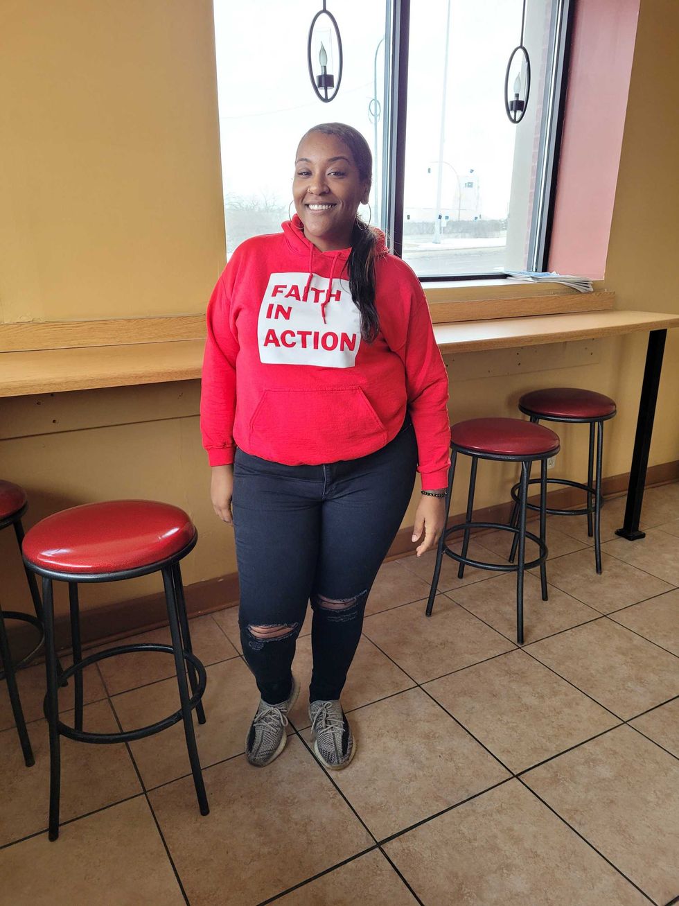 Sierra Carter smiles inside her soon-to-be vegan cafe called HEAL