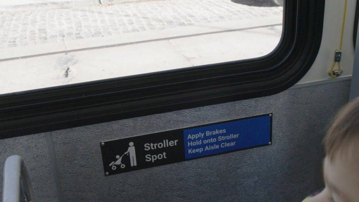 Sign for designated stroller spot inside a SEPTA bus