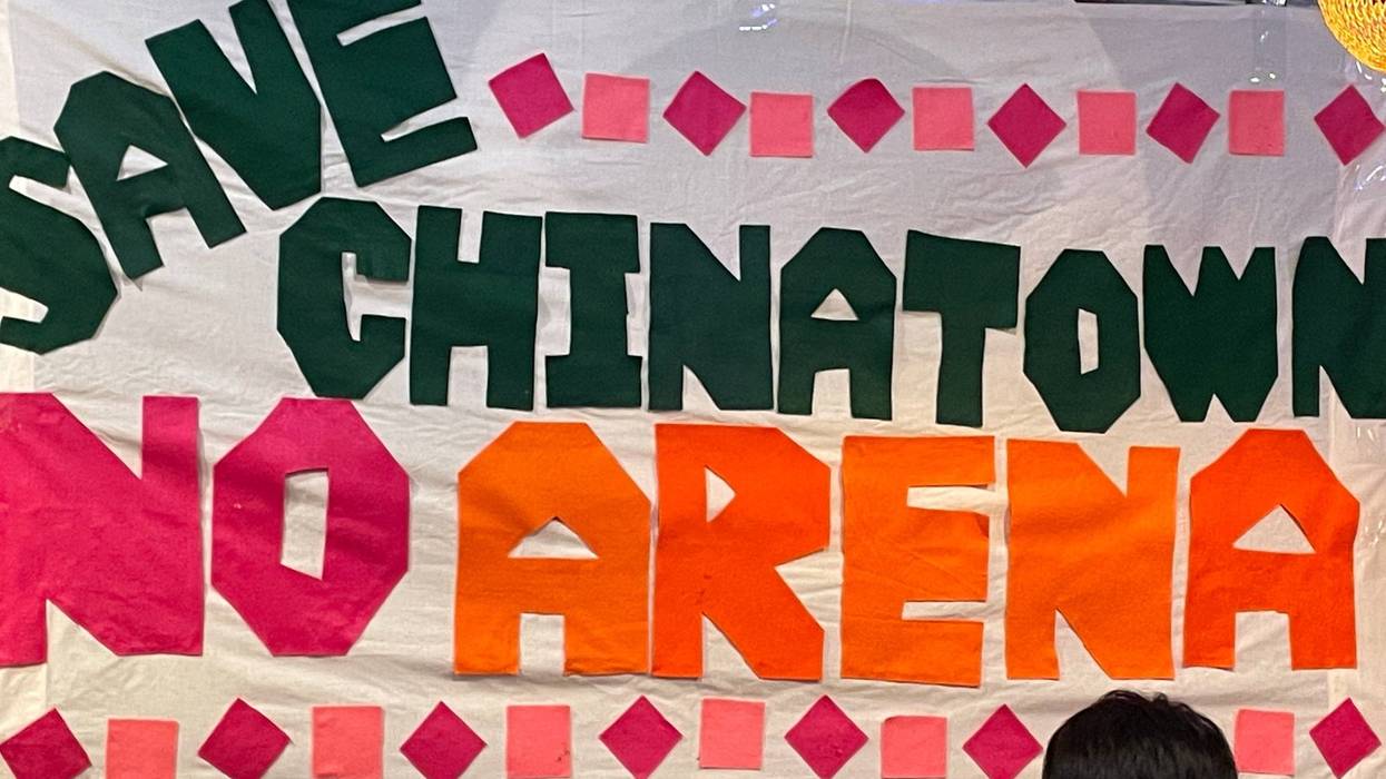 sign reads "save Chinatown, no arena"