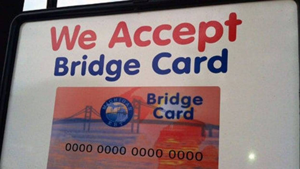 Sign reads "We Accept Bridge Card" with a picture of the Michigan EBT Bridge Card.
