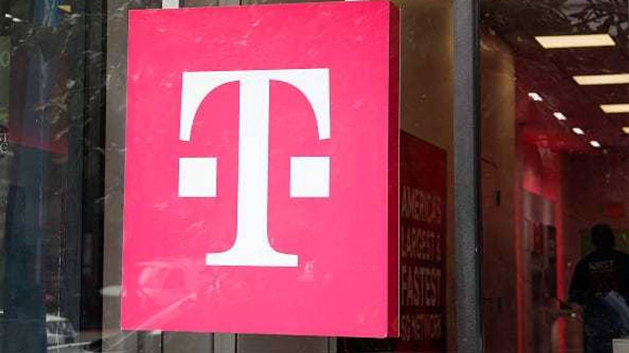 Signage for T-Mobile hangs on a storefront on August 24, 2023 in Washington, DC.