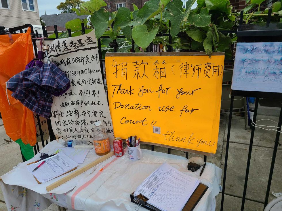 Signs and a donation book in Brighton Park