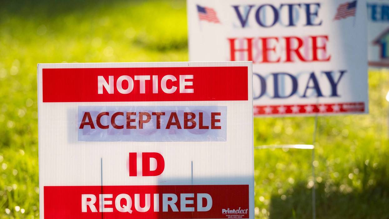 Signs greet voters at a polling place on Election Day, Nov. 3, 2020.
