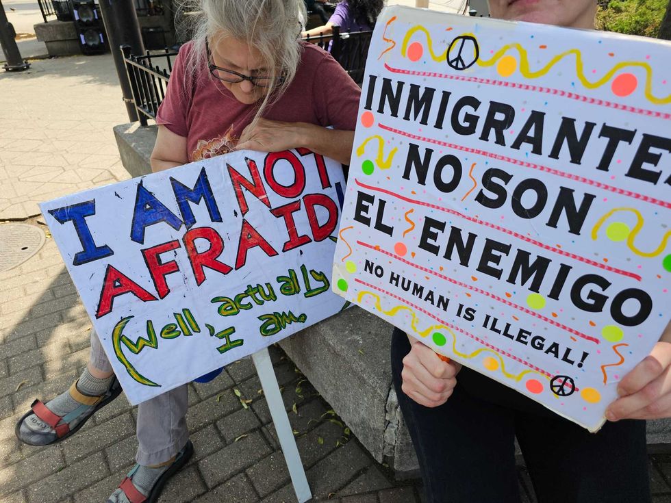 Signs held by protestors in Pilsen on Sunday Jun 8, 2025, advocating for local immigrants detained by ICE.