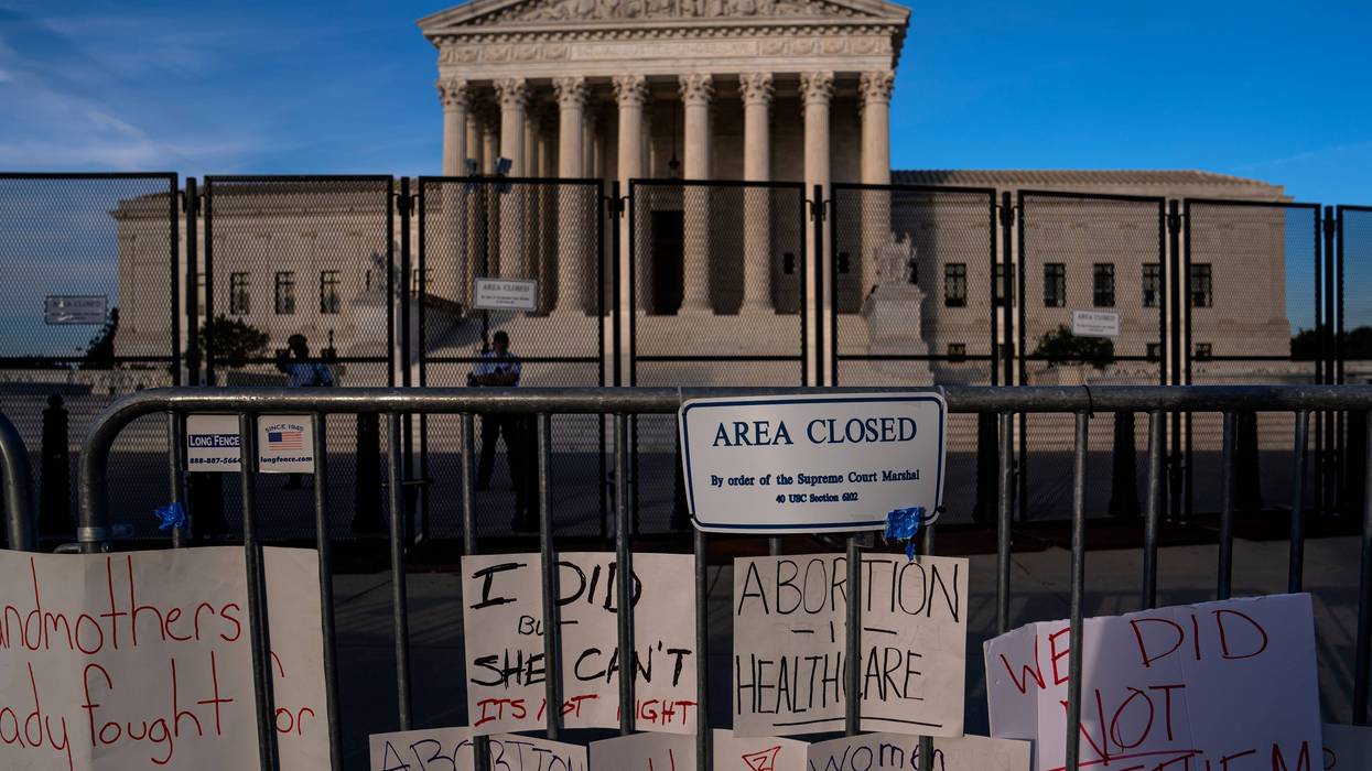 Signs left by abortion-rights supporters line the security fence surrounding The Supreme Court on June 28, 2022 in Washington, D.C.