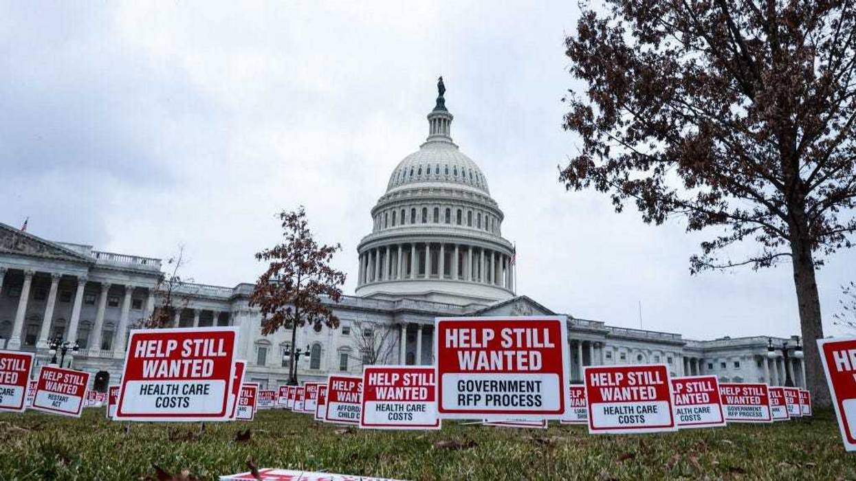 Signs reading "Help Still Wanted" sit on the east front lawn outside the U.S. Capitol on January 05, 2021 in Washington, DC.