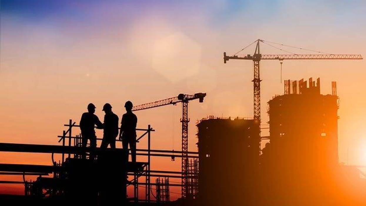 Silhouette of engineer and construction team working at site over blurred background for industry background with Light fair.Create from multiple reference images together