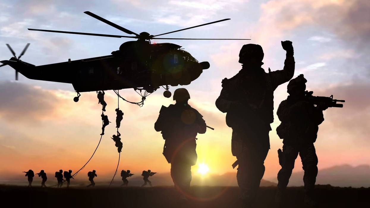 silhouette of military operation at sunset